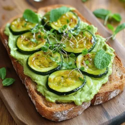 - 2 slices of whole grain bread - 1 medium zucchini, thinly sliced - 1 ripe avocado - 1 tablespoon olive oil - 1 clove garlic, minced - 1 tablespoon lemon juice - 1/4 teaspoon red pepper flakes - Salt and pepper to taste - Fresh mint leaves, for garnish - Microgreens or arugula, for topping (optional) Zucchini is low in calories and high in water. It helps keep you hydrated. This veggie is rich in vitamins A and C. These vitamins boost your immune system. Zucchini also contains fiber, which aids digestion. Avocado is a superfood packed with healthy fats. These fats can lower bad cholesterol. Avocado also has potassium, which helps your heart. Plus, it is creamy and delicious, making it a perfect toast topping. Together, zucchini and avocado create a nutrient-rich meal that tastes great. If you want to change up the recipe, here are some ideas: - Use rye or gluten-free bread instead of whole grain. - Swap zucchini for roasted eggplant or bell peppers. - Try using lemon zest for a more intense lemon flavor. - Instead of mint, use basil or cilantro for a different taste. These alternatives can add fun twists to your zucchini avocado toast. For the full recipe, check out the Zesty Zucchini Avocado Toast. To make Zucchini Avocado Toast, you will need to prep fresh ingredients. Gather your whole grain bread, zucchini, and avocado. This recipe takes about 20 minutes in total. You will love how easy this dish is to make. 1. Prep the Zucchini: Take your medium zucchini and slice it thinly. In a small bowl, mix the slices with olive oil, minced garlic, salt, and pepper. This adds great flavor. 2. Sauté the Zucchini: Heat a skillet over medium heat. Add the zucchini mix to the skillet. Cook for about 5-6 minutes. The zucchini should be tender and slightly golden. Remove from heat and set aside. 3. Mash the Avocado: Cut your ripe avocado in half. Scoop out the flesh into a bowl. Mash it with lemon juice, red pepper flakes, salt, and pepper. This will make a creamy spread. 4. Toast the Bread: While you mash the avocado, toast the whole grain bread. You want it to be nicely browned and crisp. This adds a great crunch. 5. Assemble the Toast: Once the bread is toasted, spread the avocado mix on each slice. Top with the sautéed zucchini slices. 6. Garnish: Finish by adding fresh mint leaves on top. You can also add microgreens or arugula if you like. This gives the toast a lovely look. To help you visualize each step, consider taking pictures as you cook. A video showing the sautéing process can be helpful too. You can find visual guides on cooking websites or platforms like YouTube. Check out the Full Recipe for more tips on plating and serving. To get the best avocado texture, choose a ripe avocado. Gently squeeze it; it should yield slightly. Cut it in half, remove the pit, and scoop the flesh into a bowl. Use a fork to mash it. Add lemon juice, salt, and pepper. This mix will keep it creamy and bright. If you want more flavor, add herbs like cilantro or basil. You have a few tasty options for cooking zucchini. Sautéing is my favorite because it adds a nice flavor. Slice the zucchini thin, then toss it in olive oil, salt, and pepper. Heat a skillet over medium heat, and cook for about 5-6 minutes until tender and golden. Grilling is another great method. It gives a smoky taste. Serve your zucchini avocado toast on a wooden board for a rustic look. Drizzle some extra olive oil on top for added flavor. For a pop of color, add edible flowers or a sprinkle of microgreens. Pair it with a fresh salad or a smoothie for a full meal. The combo of flavors and textures will impress everyone! For more details, check out the Full Recipe. {{image_2}} Want to kick up the heat? Add more red pepper flakes to the avocado mix. You can also try a dash of hot sauce. This gives a nice spicy kick that wakes up the flavors. For an extra layer of heat, top with sliced jalapeños. This spicy twist makes your toast exciting and full of flavor. For a taste of the Mediterranean, try adding some feta cheese. Crumble it over the zucchini. You can also sprinkle some oregano or basil for that herby taste. A drizzle of balsamic glaze will add sweetness and depth. This version is fresh and bright, perfect for summer days. If you want a vegan version, skip the feta. Instead, add a sprinkle of nutritional yeast. This adds a cheesy flavor without any dairy. You can also use sunflower seeds for a crunchy texture. This makes the toast not only vegan but also rich in nutrients. You can find all these tasty ideas in the full recipe. To store leftover Zucchini Avocado Toast, place it in an airtight container. Keep it in the fridge for up to two days. The bread may get soggy, so store the toppings separately when possible. This way, you can enjoy the crunch again when you eat it. To keep your ingredients fresh, follow these tips: - Zucchini: Store in the crisper drawer of your fridge. Use it within a week for the best taste. - Avocado: If you have leftover avocado, sprinkle lemon juice on it. This helps prevent browning. Wrap it tightly in plastic wrap or store it in an airtight container. - Bread: Keep bread in a cool, dry place. For long-term storage, freeze slices in a bag. Reheat the toast in a toaster or oven. This will bring back some crispiness. If you have sautéed zucchini, warm it in a skillet for a few minutes. Remember to avoid the microwave, as it can make the bread chewy. Enjoy your fresh and flavorful delight again! For the full recipe, check out the details above. Yes, you can use frozen zucchini. However, fresh zucchini gives better texture. If you choose frozen, thaw it first. Squeeze out extra moisture before cooking. This helps your toast stay crisp and tasty. I recommend whole grain bread for this recipe. It adds a nutty flavor and extra fiber. You can also try sourdough or sprouted grain bread for a twist. Choose a bread that toasts well and has a nice crunch. Avocado toast is best enjoyed right away. It can lose its color and flavor if left too long. If you store it, cover it tightly. It may last for a few hours in the fridge but will not taste as fresh. Enjoy it soon for the best flavor! This blog post covered delicious ways to enjoy zucchini and avocado. We explored key ingredients, their health benefits, and smart alternatives. I provided easy steps to prepare these dishes, along with helpful tips for perfect textures and flavors. You also learned fun variations to try and how to store leftovers properly. In closing, experimenting with these ingredients can yield tasty results. Enjoy your cooking and share your creations!