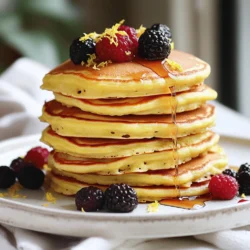 - 1 cup ricotta cheese - 1 cup all-purpose flour - 2 large eggs Lemon ricotta pancakes start with simple yet key ingredients. Ricotta cheese gives them a rich, creamy texture. The all-purpose flour provides structure, while the eggs bind everything together. These three ingredients form the heart of your batter. - 1/4 cup granulated sugar - 1/2 cup milk - Zest and juice of 1 lemon Adding sugar brings sweetness to the pancakes. Milk adds moisture, making the batter less thick. The zest and juice of the lemon give a bright, fresh flavor. This balance of taste makes every bite delightful. - 1 tablespoon baking powder - 1/4 teaspoon salt - Butter or oil for cooking Baking powder is essential for fluffiness. It helps the pancakes rise as they cook. A pinch of salt enhances the flavors, making them pop. Remember to use butter or oil in the pan to prevent sticking. This ensures your pancakes cook evenly and come out perfectly golden brown. These ingredients come together to create fluffy, zesty pancakes that are hard to resist. For the complete recipe, check out the Full Recipe. First, grab a large mixing bowl. Add 1 cup of ricotta cheese, 2 large eggs, and 1/4 cup of granulated sugar. Whisk these together until the mix is smooth and creamy. This step is key; it makes your pancakes light and fluffy. Next, pour in 1/2 cup of milk, zest from 1 lemon, and 2 tablespoons of fresh lemon juice. The zest adds brightness. Mix well until everything is combined. Now, take another bowl. In it, mix 1 cup of all-purpose flour, 1 tablespoon of baking powder, and 1/4 teaspoon of salt. Stir these dry ingredients together. This blend will give your pancakes the right rise. Slowly add the dry mix to the wet ingredients. Stir gently until just combined. Be careful not to overmix; this keeps your batter slightly lumpy, which is perfect. Heat a non-stick skillet over medium heat. Lightly grease it with butter or oil. This helps prevent sticking and gives a nice golden crust. Pour about 1/4 cup of batter onto the skillet for each pancake. Cook for 3-4 minutes. Look for bubbles on the surface and edges that look set. Then, flip the pancake and cook for an additional 2-3 minutes until golden brown. Remove the pancakes from the skillet and repeat with the remaining batter. Grease the skillet as needed to keep cooking smoothly. Now you have fluffy lemon ricotta pancakes ready to enjoy! For the full recipe, check out the details above. To make your lemon ricotta pancakes fluffy, avoid overmixing the batter. When you stir, mix just until the flour disappears. A few lumps are fine. This helps keep the pancakes light and airy. Next, ensure you have an even cooking temperature. Heat your skillet over medium heat. If it's too hot, the pancakes will burn on the outside and stay raw inside. Use a non-stick skillet for best results. For more flavor, experiment with spices. A pinch of cinnamon can add a warm touch. You might also try nutmeg for a unique twist. Another great tip is to add vanilla extract to the batter. This small addition boosts the flavor and brings out the lemon's brightness. You can enhance your lemon ricotta pancakes even more with these simple tricks. For the full recipe, check out the [Full Recipe]. {{image_2}} You can easily add a burst of flavor to your pancakes. Mixing in blueberries or strawberries enhances their taste. Just fold in about a cup of fresh or frozen fruit into the batter. You can also top your pancakes with seasonal fruits. Try sliced bananas, peaches, or even a berry mix. This not only adds sweetness but also makes your dish more colorful. If you want a gluten-free version, it's simple! Swap the all-purpose flour for almond flour or coconut flour. These flours give a different texture but still maintain that delightful taste. Just remember that coconut flour absorbs more moisture. So, you might need to add a bit more milk to your batter. For a fun twist, turn your sweet pancakes savory. Add herbs like basil or parsley into your batter. About two tablespoons should do the trick. Pair these pancakes with a light salad or a poached egg for a unique meal. This savory option is great for brunch or lunch. Feel free to explore these variations to make your Lemon Ricotta Pancakes even more exciting! Check out the Full Recipe for more details. After you make your lemon ricotta pancakes, you may have leftovers. Store them in the fridge for up to three days. Place them in an airtight container. This helps keep them fresh and moist. If you stack them, use parchment paper between each pancake. This prevents sticking. To reheat, simply warm them in a skillet or microwave. If using a microwave, heat them for about 30 seconds. Check to see if they are warm enough. If not, heat for a few more seconds. You can also freeze these pancakes for later. To freeze, let them cool completely first. Then, stack them with parchment paper in between. Place them in a freezer-safe bag or container. This prevents them from sticking together. When you're ready to eat, thaw them overnight in the fridge. You can also microwave them for quick defrosting. Heat them for about one minute on medium power. This method keeps them fluffy and delicious. To make your pancakes fluffy, you need to add air to the batter. Start by beating the eggs well; this adds volume. Next, use a light touch when mixing. Overmixing can take the air out, making them dense. Another tip is to let the batter rest for a few minutes. This helps the gluten relax and creates a lighter texture. Yes, you can substitute ricotta cheese. Cottage cheese works well if you blend it smooth. Cream cheese is another option, but it may change the taste. Greek yogurt can also work, giving a tangy flavor. Just remember, each choice will change the pancake's texture and taste a bit. These pancakes are great with many toppings. Maple syrup is classic, adding sweetness and warmth. Fresh berries, like strawberries or blueberries, brighten the dish. You can also add whipped cream for a fun twist. A sprinkle of powdered sugar adds a nice touch too. For the complete details, check the Full Recipe for Lemon Ricotta Pancakes. Lemon ricotta pancakes offer a tasty twist on a breakfast favorite. You mix simple ingredients, like ricotta, flour, and eggs, to create a fluffy batter. Cooking tips help you achieve the perfect texture and flavor. You can even try fruit or savory options for new ideas. Remember to store leftovers properly for later enjoyment. With these easy steps, you can impress anyone at breakfast. Enjoy your delicious, homemade lemon ricotta pancakes!