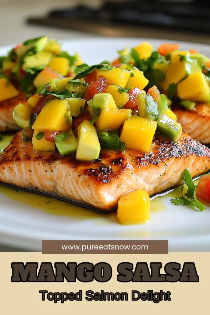 Discover a deliciously healthy salmon recipe with this Mango Avocado Salsa Salmon! This easy seafood dinner combines tender salmon fillets topped with a vibrant fresh salsa for fish made from ripe mango, creamy avocado, and zesty lime cilantro sauce for salmon. Perfect for a quick weeknight meal or special occasion. Save this recipe for a refreshing twist on your dinner menu! #MangoAvocadoSalsaSalmon #HealthySalmonRecipe #EasySeafoodDinner #FreshSalsaForFish