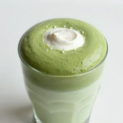 To make whipped matcha Dalgona, you need a few key items. These ingredients create a rich and creamy drink. Here&rsquo;s what you will need: - 2 tablespoons matcha powder - 2 tablespoons hot water - 2 tablespoons granulated sugar - 1 cup milk (dairy or plant-based) - Ice cubes (optional) - A pinch of sea salt - Whipped cream (for garnish, optional) Each item plays a big role in the flavor and texture. The matcha powder gives the drink its vibrant green color and unique taste. Sugar adds sweetness, while sea salt enhances the overall flavor. You can customize your whipped matcha Dalgona in many ways. Here are some fun ideas: - Add whipped cream on top for extra creaminess. - Sprinkle cocoa powder or cinnamon for a warm flavor. - Use flavored syrups like vanilla or caramel for added sweetness. - Try different milk types, such as almond, oat, or coconut for a twist. These options let you create a drink that suits your taste. To make this drink, you will need some basic kitchen tools. Here&rsquo;s what I recommend: - A medium bowl for mixing - A hand mixer or whisk for whipping - A serving glass to present your drink - A measuring spoon for precise ingredients Having the right tools makes the process easier and more fun! {{ingredient_image_1}} To start, gather your ingredients. You will need: - 2 tablespoons matcha powder - 2 tablespoons hot water - 2 tablespoons granulated sugar - 1 cup milk (dairy or plant-based) - Ice cubes (optional) - A pinch of sea salt - Whipped cream (for garnish, optional) In a medium bowl, mix the matcha powder with hot water and sugar. Stir until combined. The heat from the water helps dissolve the matcha and sugar well. Now, grab a hand mixer or a whisk. If you use a mixer, whip the mixture for 3-5 minutes. If you whisk by hand, it may take 8-10 minutes. You want it to be thick and frothy, similar to whipped cream. During this process, add a pinch of sea salt. This step boosts the flavor of your whipped matcha. Keep whipping until you see soft peaks forming. Take a serving glass and pour in the milk. Fill it halfway. If you like it cold, add ice cubes. Next, spoon the whipped matcha over the milk. This creates a lovely layered look. You can mix it gently before drinking or enjoy the layers. For an extra treat, top with whipped cream. It adds a nice touch and taste. To get that dreamy whipped texture, use a hand mixer. It&rsquo;s fast and easy! Start by mixing matcha powder, hot water, and sugar. Whip it for about 3-5 minutes. The mix should grow thick and fluffy. If using a whisk, be patient. It will take around 8-10 minutes. Adding a pinch of sea salt while whipping helps bring out the matcha&rsquo;s best flavors. One big mistake is using cold water. Always use hot water to dissolve the matcha well. Another error is not whisking enough. You want to whip until it looks like whipped cream. Don&rsquo;t skip the sugar; it balances the matcha&rsquo;s bitterness. Lastly, don&rsquo;t rush pouring the whipped mix over the milk. Take your time for that stunning layered look. Choose high-quality matcha for the best taste. Look for bright green powder; this shows freshness. Ceremonial grade matcha works great for drinks. It has a smooth taste and rich color. Avoid culinary grade matcha; it&rsquo;s more bitter and not as vibrant. Store your matcha in a cool, dark place. This keeps it fresh and tasty for longer. Pro Tips Quality Matcha Matters: Use high-quality ceremonial grade matcha for the best flavor and vibrant color in your whipped Dalgona. Whipping Technique: If you don&rsquo;t have a hand mixer, a bamboo whisk (chasen) is excellent for achieving a frothy consistency. Milk Choices: Experiment with different types of milk, like oat or almond milk, to find your favorite pairing with matcha. Serving Suggestions: For a fun twist, add flavored syrups or spices like vanilla or cinnamon to your milk before adding the whipped matcha. {{image_2}} You can change the sweeteners in your whipped matcha. Try honey or maple syrup instead of sugar. These options add a nice flavor twist. You can also use coconut sugar for a darker, richer taste. For milk, you can use almond, oat, or soy milk. Each type gives a unique taste to the drink. Want to boost the flavor? Try adding a splash of vanilla extract. It gives a warm, sweet note. You can also mix in some cocoa powder for a chocolate twist. If you like a spicy kick, add a dash of cinnamon or ginger. Each of these adds a fun layer to your Dalgona. Seasonal flavors can make this drink special. In fall, add pumpkin spice for a cozy vibe. Just mix a teaspoon of pumpkin spice into the whipped matcha. For winter, stir in some peppermint extract for a fresh taste. Chocolate lovers can mix in cocoa powder year-round. These adaptations make your whipped matcha a treat for any season! If you have whipped matcha left over, store it in an airtight container. Keep it in the fridge for up to three days. Cover it well to prevent it from drying out. When you want to enjoy it again, just give it a gentle stir. Whipped matcha does not need reheating. It is best enjoyed cold or at room temperature. If you want it warmer, let it sit out for a few minutes. Then, mix it back up for a smooth texture. Matcha powder stays fresh for about six months if stored in a cool, dark place. Granulated sugar and sea salt last much longer. Milk, whether dairy or plant-based, lasts about a week after opening. Always check for any off smells or changes before using. You can use instant matcha, but it may not whip as well. Instant matcha blends quickly in water. The texture may be less creamy. If you try it, use the same amount as regular matcha. To make whipped matcha dairy-free, simply use plant-based milk. Almond, oat, or soy milk work great. Each type gives a unique taste. Just follow the same steps as the recipe. Enjoy your creamy treat without dairy! The best matcha for Dalgona is high-quality, culinary grade. Look for bright green color and a fine texture. This ensures a smooth whip and rich flavor. Brands like matcha Konomi or Encha are good choices. Quality matcha makes all the difference! Whipped Matcha Dalgona offers a delightful mix of flavors and textures. We explored the key ingredients, preparation steps, and handy tips to make your drink just right. Remember to choose high-quality matcha and experiment with tasty variations. Store any leftovers properly to keep them fresh. Enjoy crafting your perfect cup. With these steps, anyone can master this trendy drink easily. Dive into the world of whipped matcha and savor every sip!